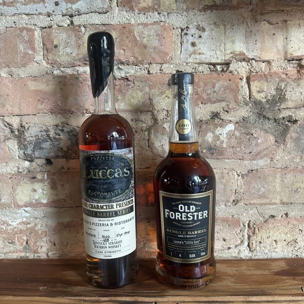 image of two bottles on a shelf: Rare Character Single Barrel Selection and Old Forester Single Barrel Selection