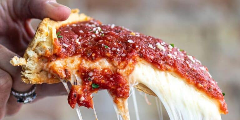 Slice of deep dish pizza